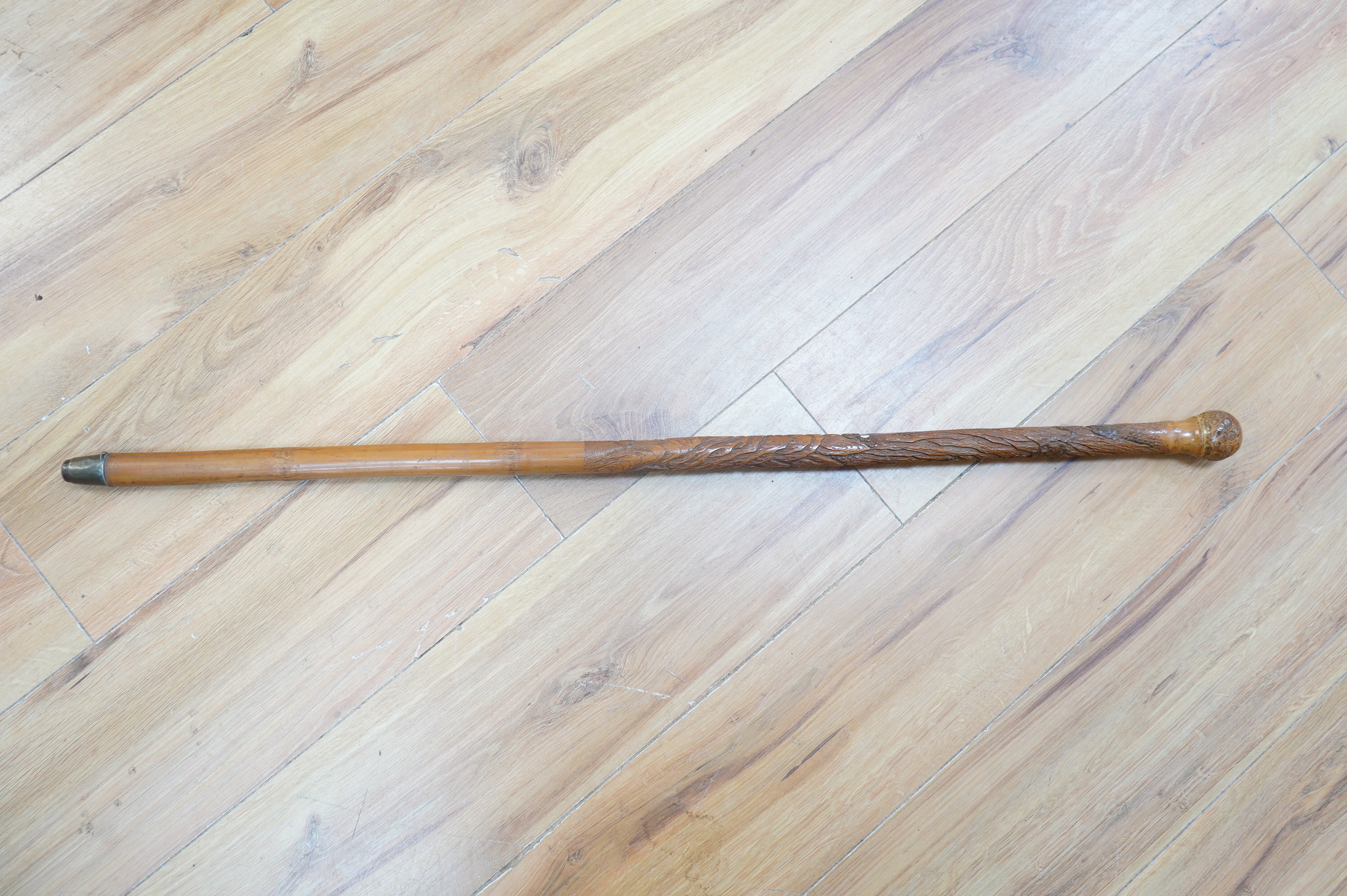 A Japanese carved bamboo walking cane with mother of pearl and ivory inlay. 89.5cm long. CITES Submission reference Submission reference 3UEQCLUL. Condition - fair